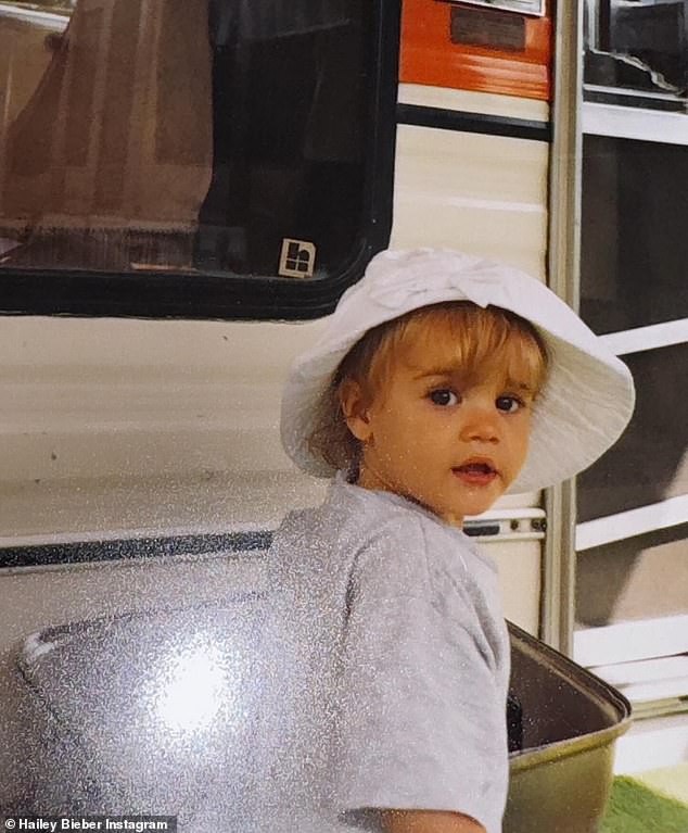 Another snap showed Justin as a toddler, wearing a white bucket hat and gray T-shirt.