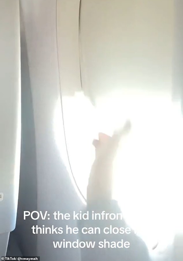 Umaymah wanted the light to come in during the flight, while the boy in front of her was not so sure.