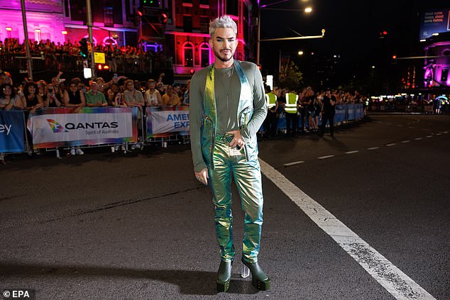 Adam kept with the green theme with his army green shirt and finished the look with sky-high clear heels.
