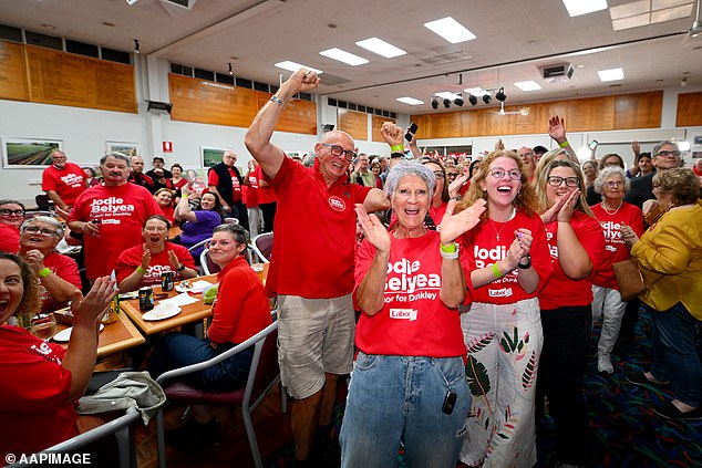 Labor Party supporters are seen celebrating in Frankston as the announcement is made.