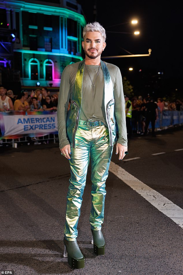 The Queen frontman looked dapper as he led the parade on Saturday night in a green ensemble.