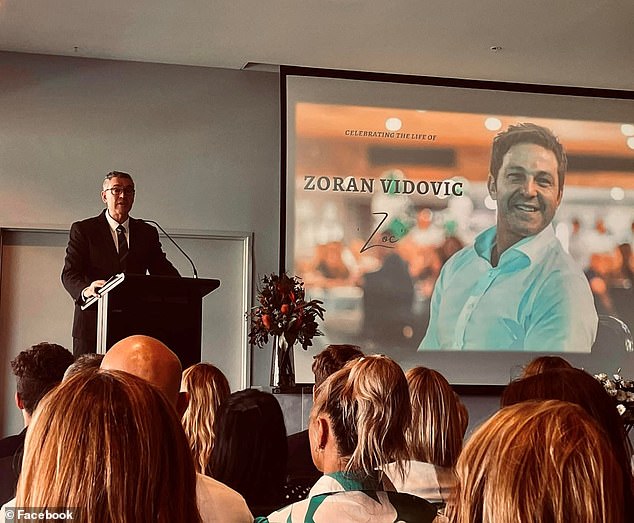 Zagi Kozarov says he was even banned from attending the memorial service (pictured) for Zoran Vidovic, where hundreds of mourners packed the GHMBA stadium social hall.
