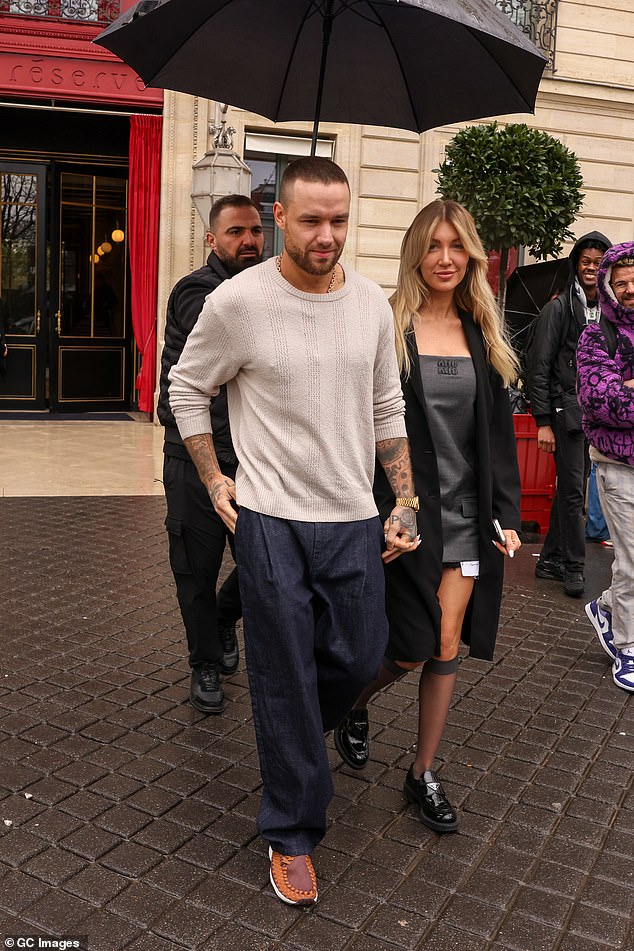 Liam cut a casual figure for the outing in a white jumper which he wore with a pair of navy jeans.