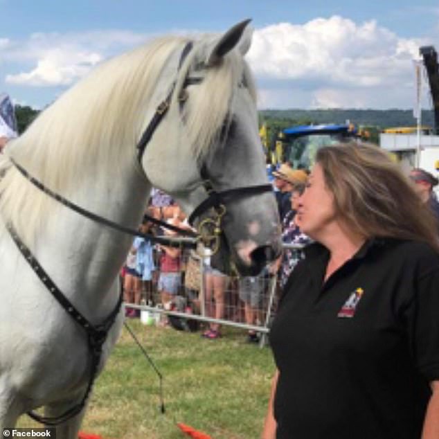 Prosecutor Sean Brunton KC told the jury that Mrs Rawle (pictured with a horse) had taken the knife to cut a cord to tie the doors as her husband had asked.