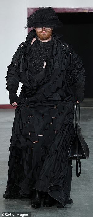 Then they put on a black ripped gothic dress and he turned heads at the show.