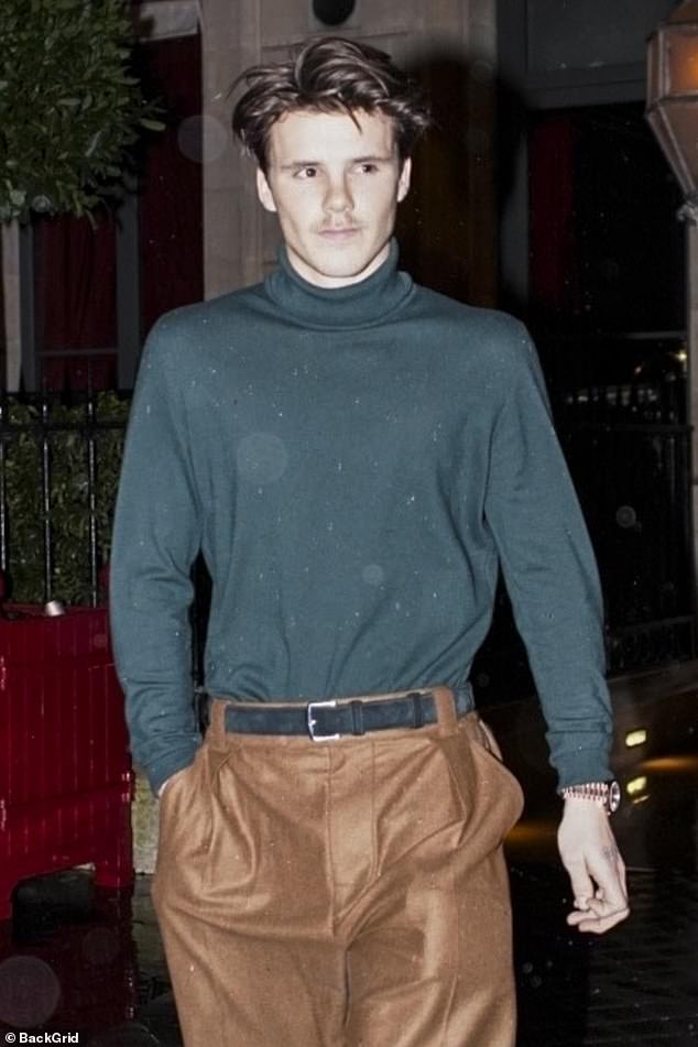 Cruz opted for an elegant sweater and pants