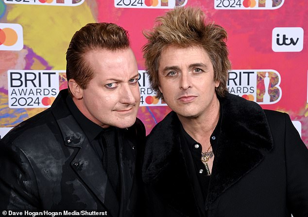 Tré Cool and Billie Joe Armstrong, of the American pop punk band, attended the award ceremony for best British group, and were introduced by Roman