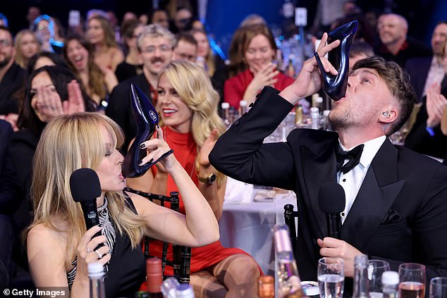 Elsewhere in the chaotic ceremony, Roman convinced Global Icon award winner Kylie Minogue to do a 'shoey', an Australian tradition of drinking out of a shoe.