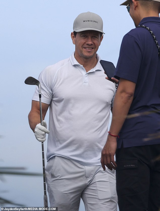 1709452695 886 Mark Wahlberg enjoys a round of golf with friends in