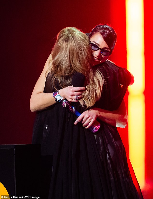 They hugged after she presented him with the award, which came before Kylie's incredible medley performance.