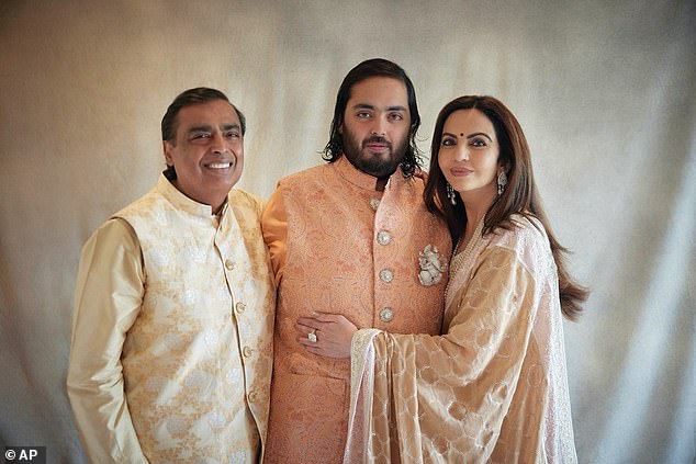 (From left to right) Billionaire industrialist Mukesh Ambani, his son Anant and his wife Nita,