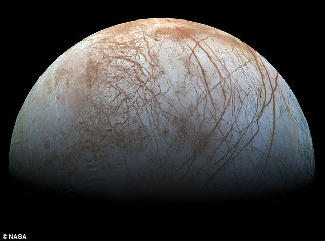 Pictured is Jupiter's moon Europa, where an ocean hidden under miles of ice is considered a prime candidate for extraterrestrial life.  Scientists have found carbon dioxide (CO2) on the surface of Europa and the next step is to determine where it comes from