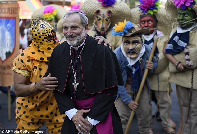 The bishop of Guerrero posed with dancers and community members as they celebrated his arrival to office in April 2022.