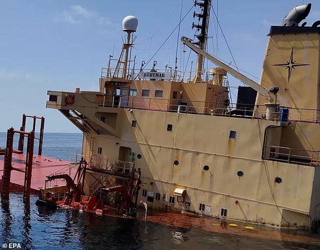 A photograph provided by the Yemeni channel Al-Joumhouriya TV shows the cargo ship Rubymar, sinking after being damaged in a missile attack by the Houthis in the Red Sea.