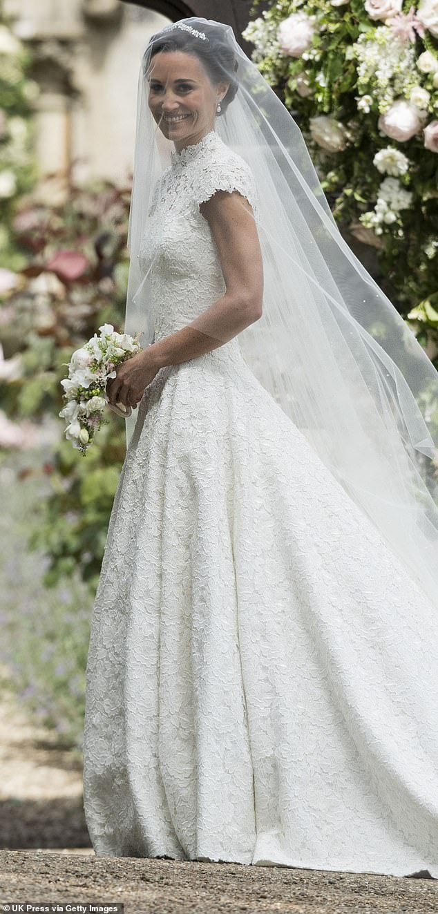 Pippa paired her stunning dress with a cathedral-length veil by British milliner Stephen Jones.