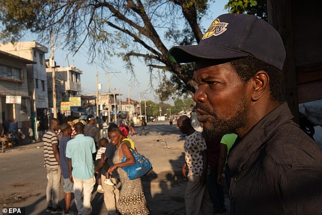 People gather in front of the National Penitentiary prison in Port-au-Prince, Haiti.