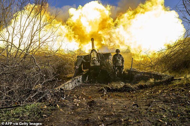 A Ukrainian soldier from an artillery unit fires at Russian positions on the outskirts of Bakhmut.