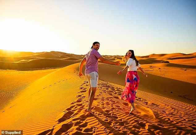 Like Eva and Tim (pictured in the Sahara desert), many young Kiwis vote with their feet.