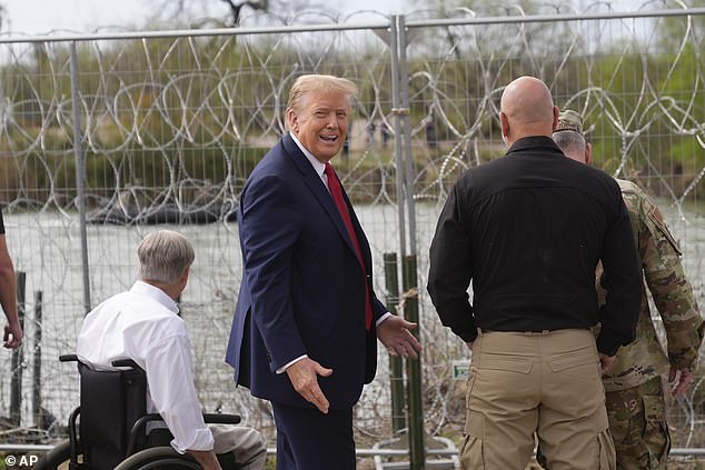 Republican presidential candidate former President Donald Trump gestures after greeting people across the Rio Grande in Mexico in Shelby Park during a visit to the US-Mexico border.