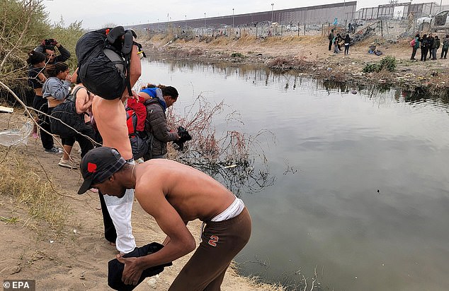 Migrants prepare to cross the Rio Grande on Thursday