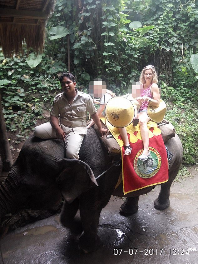 Samantha Murphy rides an elephant during a trip to Bali in 2017