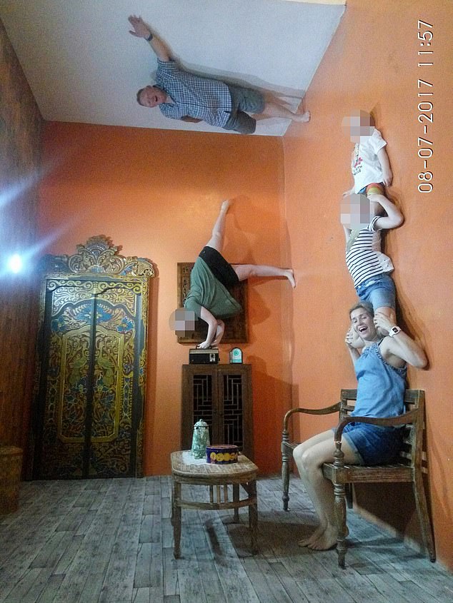 Samantha Murphy, her husband Mick and their children have fun in a upside down house in Bali