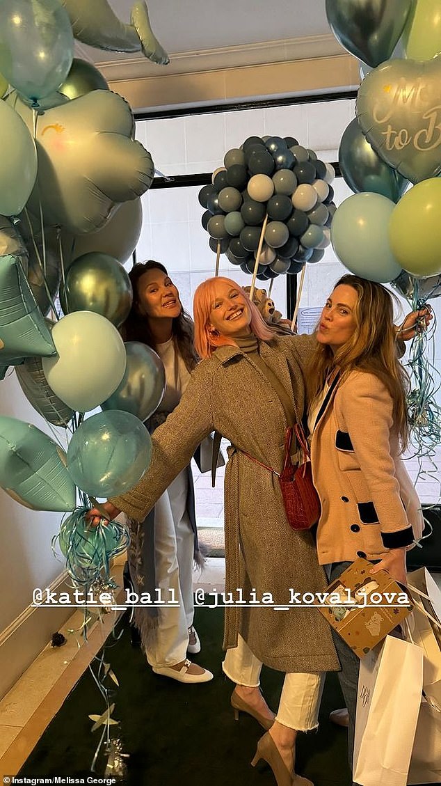 Another photo showed Melissa posing with some friends in front of decorative blue balloons.