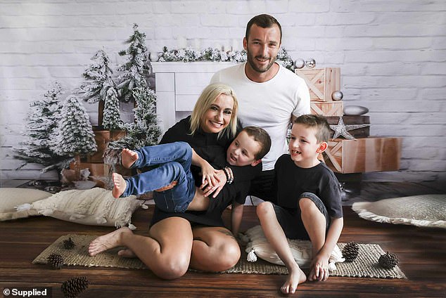 Andrew Pearman is pictured with his partner, Lauren Moore, and two of their three children: Sage, left, and Braxton, right.