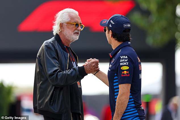 Former Benetton F1 team boss Briatore greets Red Bull driver Sergio Perez at the Bahrain circuit on Saturday