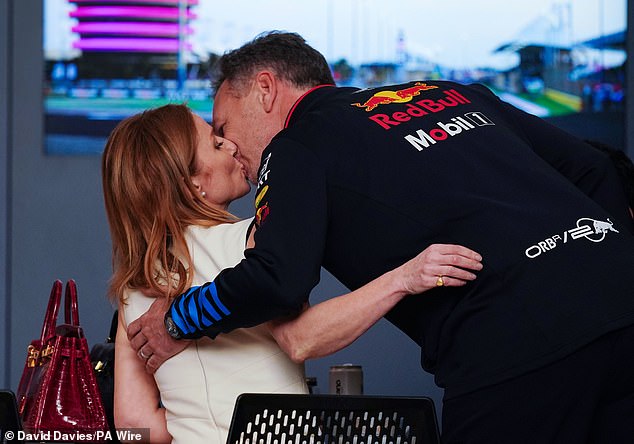Halliwell kisses her husband before the start of the Bahrain Grand Prix on Saturday afternoon