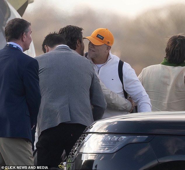 Zara Tindall's husband Mike pictured hugging a fellow traveler after landing in the UK