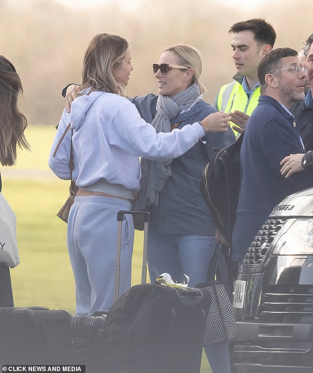 Mum-of-three Zara Tindall seen hugging a friend after flying back to Oxford from Bahrain this morning