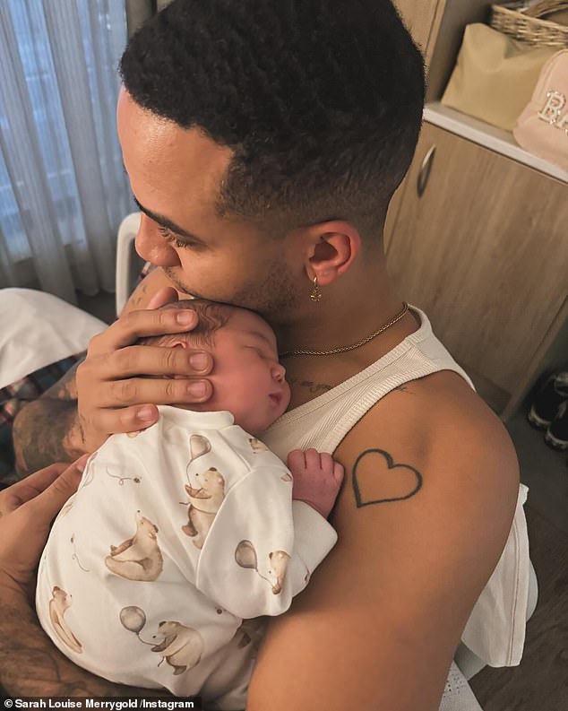 In another image, Aston held his daughter while she slept on his chest wearing a cute baby bear.