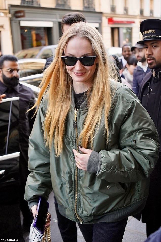The actress dressed in an oversized khaki bomber jacket which she paired with a pair of dark jeans and a turtleneck top.