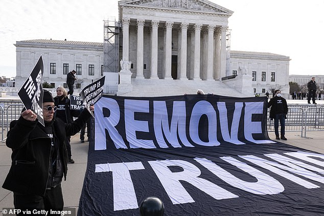 Anti-Trump protesters protest outside the US Supreme Court before the court decides whether former US President Donald Trump is eligible to run for president in the 2024 election in Washington, DC, on February 8, 2024.