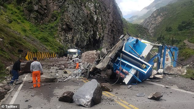 The first truck that was flattened by multiple rocks was completely destroyed, but its driver survived.