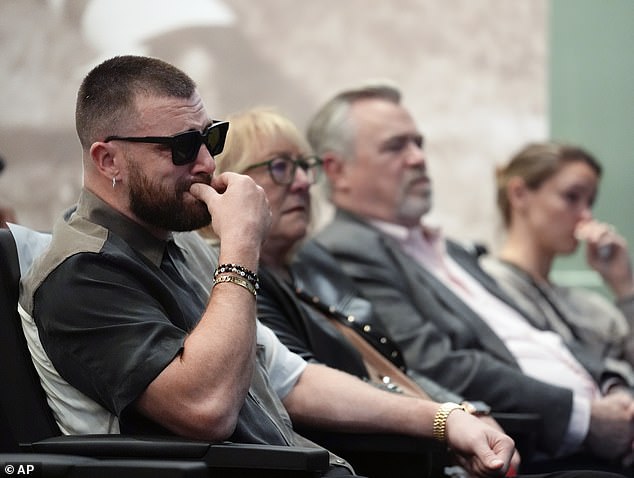 Travis Kelce burst into tears as he watched his brother speak, sitting next to his parents.