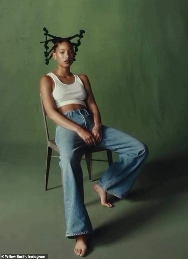 The recording showed the artist sitting in a chair with a green background.