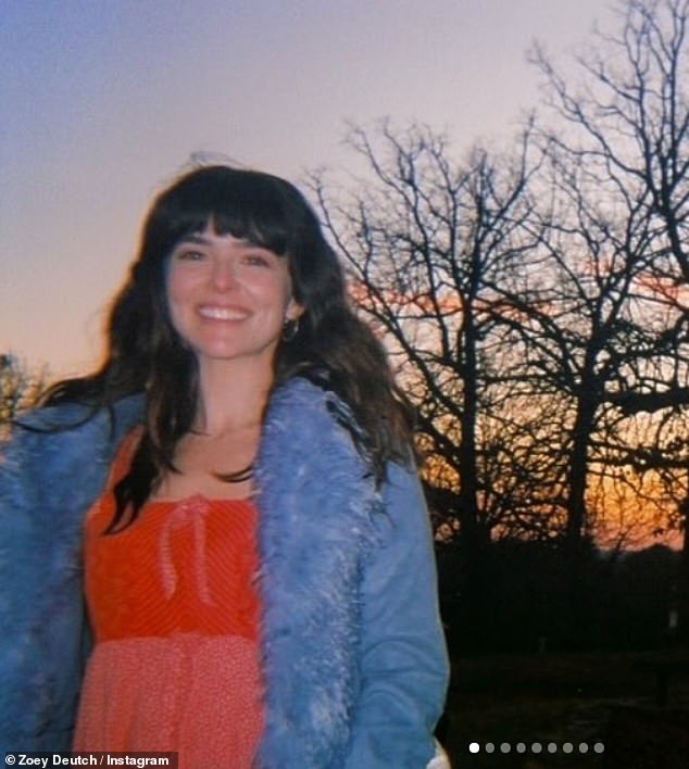 Zoey pictured with her usual long, dark brown locks and full bangs in February