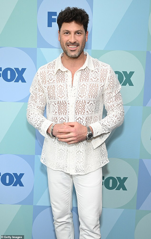 Chmerkovskiy was on-trend in a sheer button-down shirt with a doily print.
