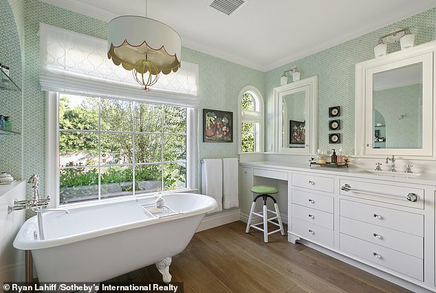 He originally purchased the home, which was built in 1926, for $2.3 million in 2019. One bathroom features a claw-foot tub and separate tiled shower, built-in vanity and double mirrors.