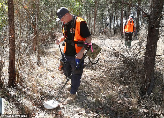 Pictured, metal detectorists volunteer to help search for missing mother Samantha Murphy.