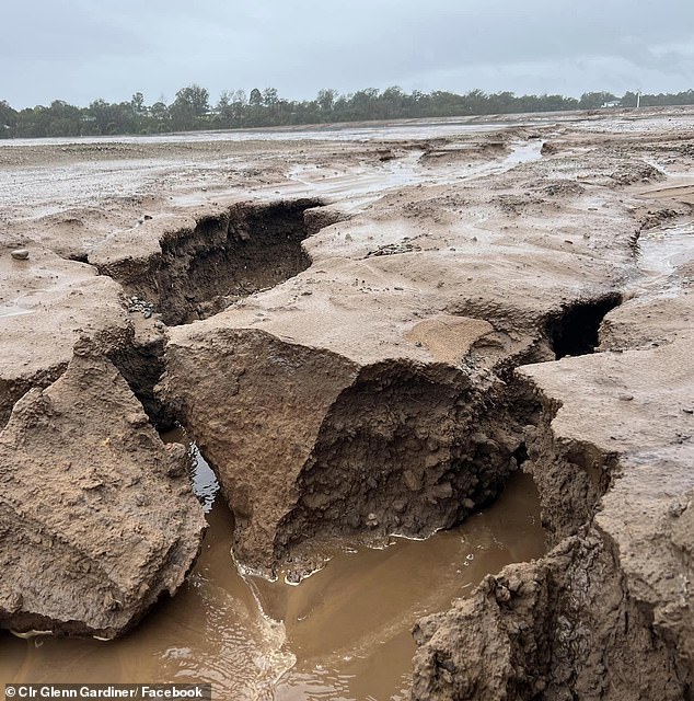 The day after the beach opened, Penrith councilor Glenn Gardiner shared photos of the 'car park' (above) which appeared to have turned into a sinkhole after 30mm of rain.