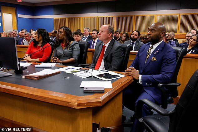 The embattled Fulton County district attorney surprised the audience by sitting behind the prosecutor's table, just a few seats away from her former lover.