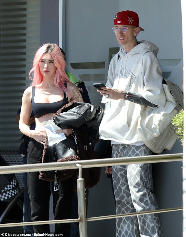 The mother of three wore her pastel pink locks in a straight style, cascading down her back.