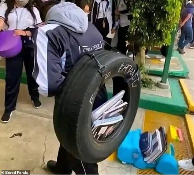 Where there's a will there's a way...this kid wasn't going to let the lack of a backpack get in the way of his school day.