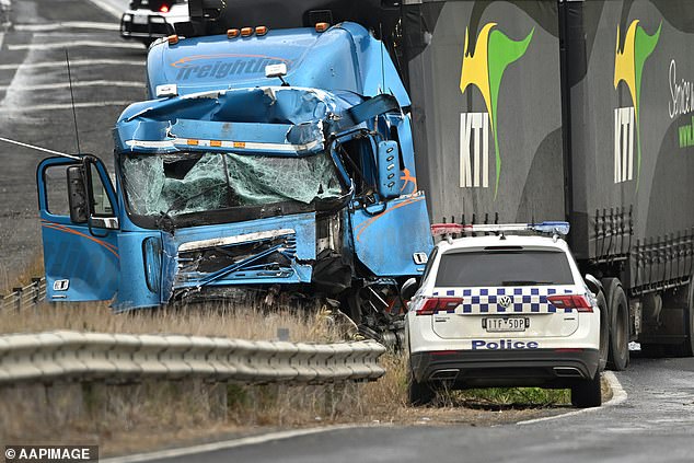 Truck driver Brett Russell was charged with 80 offences, including dangerous driving causing serious injury and reckless conduct endangering life, after he allegedly rear-ended the Loreto College Ballarat bus (pictured: the crashed truck).