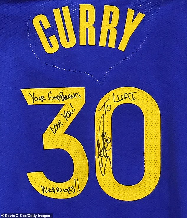 The 35-year-old NBA star even autographed a 'To Luai, Your Godfathers Love You' T-shirt for the couple during Sunday's game at State Farm Arena in Atlanta.
