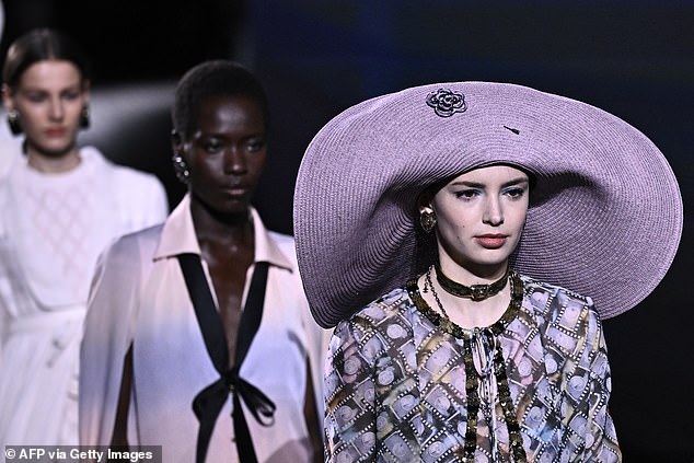 Lilac was one of the key colors on the runway and look at that floppy hat!