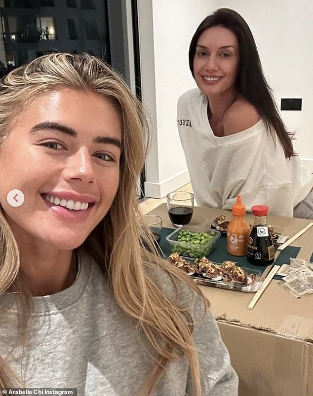 Arabella enjoyed an evening in her stylish new abode, eating sushi with her friend Charlotte Edwards and using a moving box as a makeshift table.